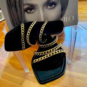 JLO black flat sandals.